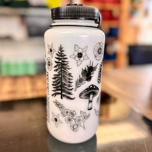 A white water bottle with black ink and a plants and flowers design